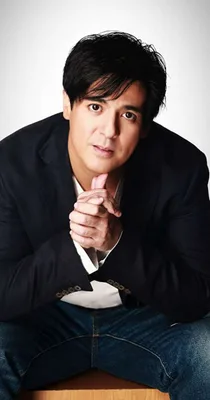 Aga Muhlach in a black jacket; an undated studio portrait from his Shawtout talent profile. The URL indicates publication in July 2021, not the year the photograph was taken.